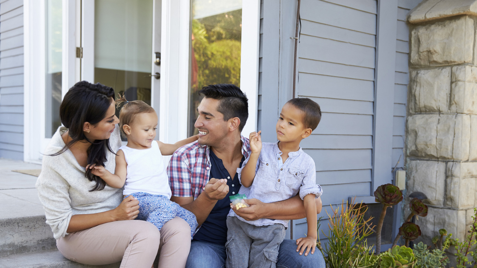 A VA Streamline Loan is a powerful tool for veterans! american family sitting on porch