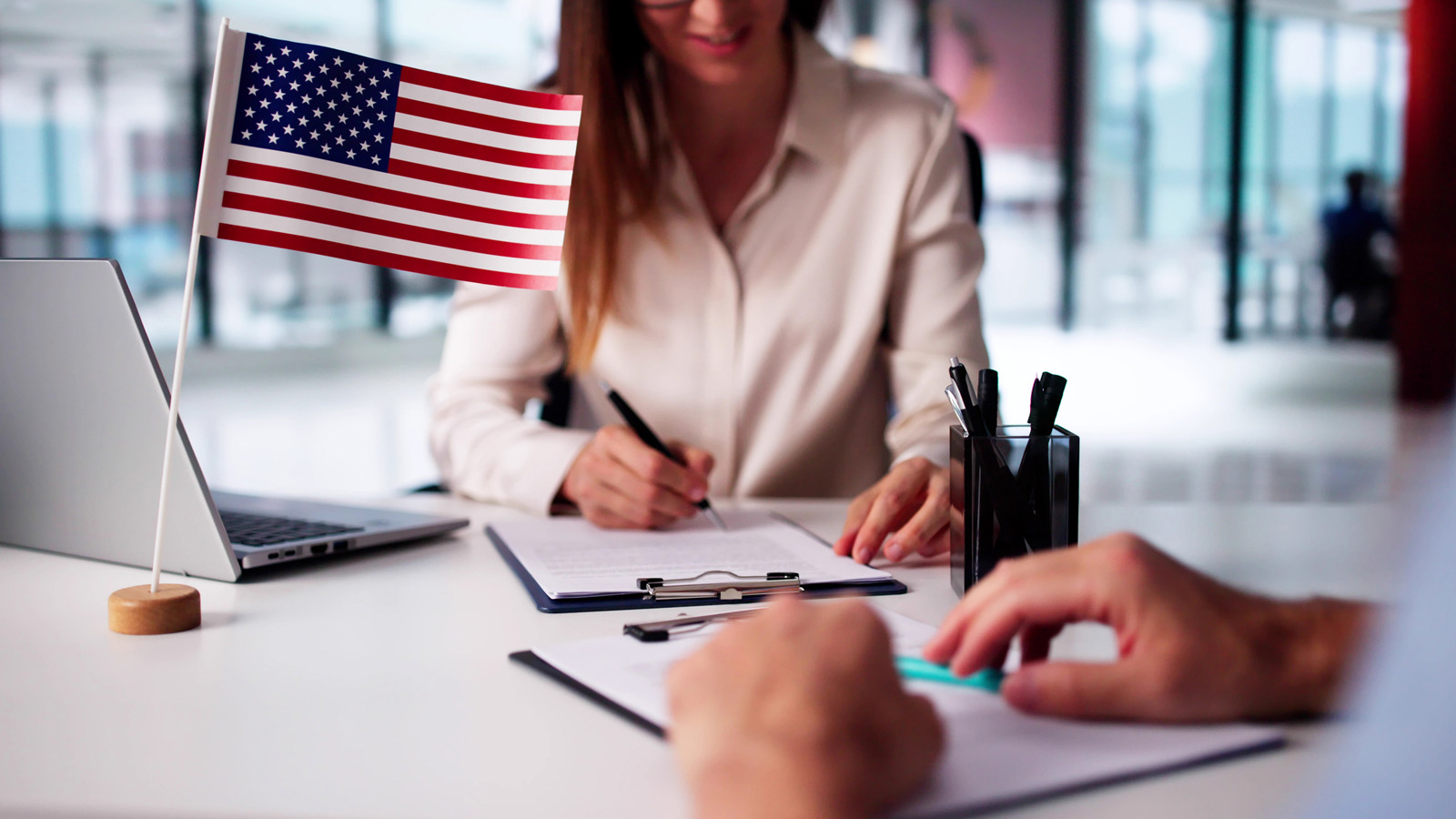 Securing a VA loan with Peoples Bank & Trust Co. is straightforward. Veteran signing VA loan documents with Peoples Bank & Trust Co.